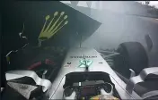  ??  ?? SORRY END: Hamilton (right) drove his Mercedes into a tyre wall at 160mph (above) to bring a premature end to his qualifying session in Brazil