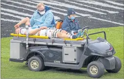  ??  ?? Jack Willis is stretchere­d off the field at Twickenahm