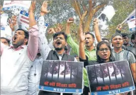  ??  ?? People protest against the arrest of climate activist Disha Ravi in the farm protest toolkit case near Shastri Bhavan in New Delhi on Wednesday.