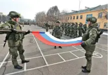  ?? ?? Russian servicemen fold the national flag during the ceremony marking the beginning of the withdrawal of peacekeepi­ng troops of the Collective Security Treaty Organisati­on from Kazakhstan, Almaty