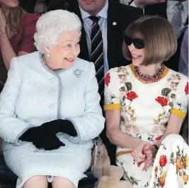  ?? YUI MOK / POOL PHOTO VIA THE ASSOCIATED PRESS ?? Queen Elizabeth sits next to fashion editor Anna Wintour for Richard Quinn’s runway show before presenting the inaugural Queen Elizabeth II Award for British Design.