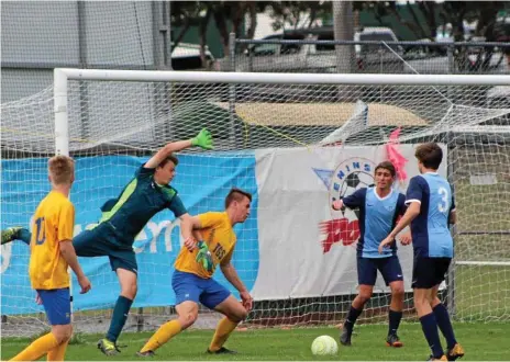  ?? Photo: Rochelle Green ?? CUP CLASH: Grammar’s Henry Wells challenges for the ball during his side’s match against Kawana Waters State College.