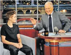  ?? CBS ?? Canadian pop star Justin Bieber, left, visited David Letterman in 2012.