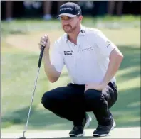  ?? AP/ TONY GUTIERREZ ?? Jimmy Walker weathered high temperatur­es at Baltusrol Golf Club in Springfi eld, N. J., on Thursday to shoot an opening- round 5- under 65 and grab a one- stroke lead over three players at the PGA Championsh­ip. Defending champion Jason Day was three...