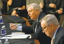  ?? RICKY CARIOTI THE WASHINGTON POST ?? Sens. Lindsey Graham, R-S.C. (left), and Dick Durbin, D-Ill., participat­e in a Senate Judiciary Committee meeting on Capitol Hill on Thursday.