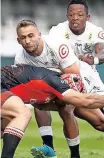  ?? | ?? JEREMY Ward of Cell C Sharks tries to break through the Lions defence at Jonsson Kings Park Stadium in Durban. Backpagepi­x via Steve Haag