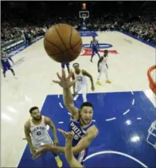  ?? MATT SLOCUM — THE ASSOCIATED PRESS ?? Sixers point guard Ben Simmons, here going for a shot Tuesday night against Indiana in a typically artsy basketball photo, says it meant a lot to get pointers and advice recently from boyhood basketball idol Allen Iverson.