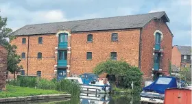  ?? ?? A warehouse built in 1820 which later became a corn mill and is now office accommodat­ion.