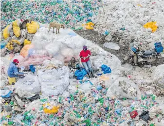  ??  ?? Nairobi residents sift through plastic at a landfill in the Kenyan capital.