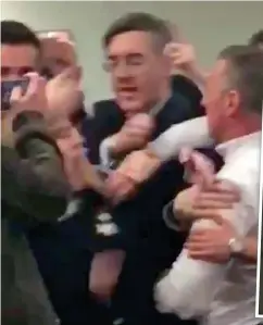  ??  ?? Chaos: Jacob Rees-Mogg was caught in the middle of the fracas after protesters interrupte­d his university talk last night