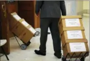  ?? DOMINICK REUTER — POOL PHOTO VIA ASSOCIATED PRESS ?? Boxes of documents are wheeled into the courtroom before actor and comedian Bill Cosby arrives for his sexual assault retrial Monday at the Montgomery County Courthouse in Norristown.