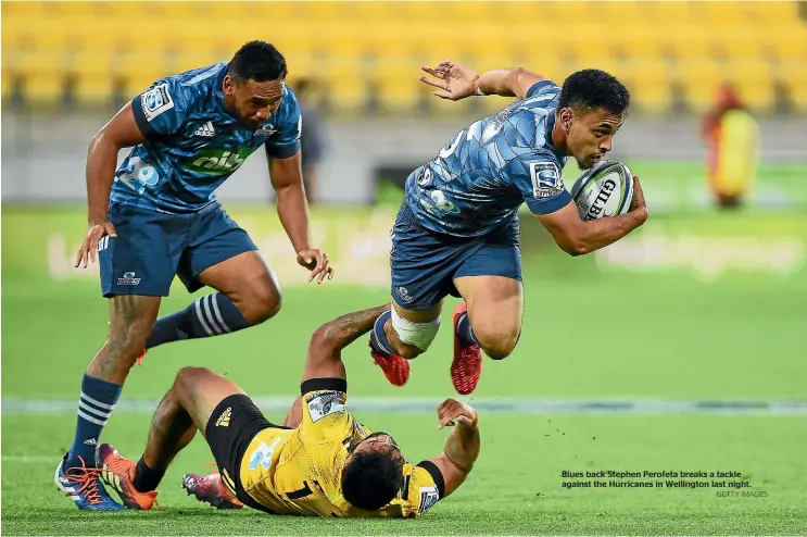  ?? GETTY IMAGES ?? Blues back Stephen Perofeta breaks a tackle against the Hurricanes in Wellington last night.
