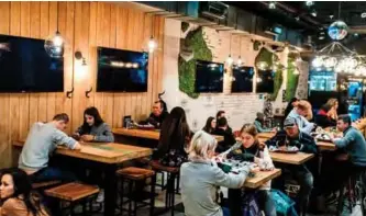  ??  ?? A view of an outlet of Cameroonia­n entreprene­urs Walter and Cindy Tchassem’s Black Star burger chain on Moscow’s Novy Arbat.
— AFP photos