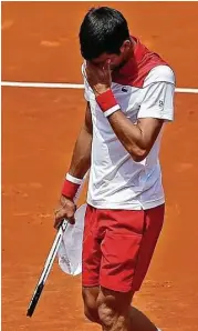  ?? Paul White / Associated Press ?? Novak Djokovic shows his dismay during a loss to Kyle Edmund in the second round of the Madrid Open.