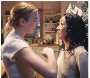  ?? BELL MEDIA ?? Killing Eve writer Phoebe Waller-bridge says BBC America wanted to limit blood and gore in the television series, which stars Jodie Comer, left, and Sandra Oh.