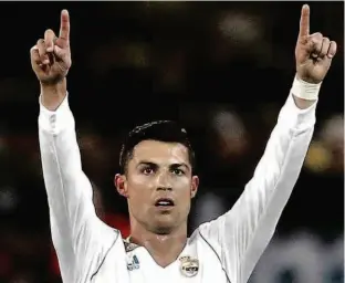  ?? Michael Probst/AP ?? Cristiano Ronaldo vibra após marcar o seu segundo gol no jogo de ontem; o craque português chegou a 411 gols em 400 jogos pela equipe merengue