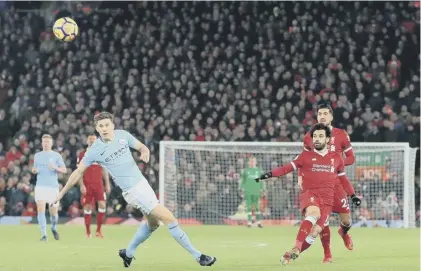 ??  ?? 2 Mohamed Salah scores Liverpool’s fourth goal with a longrange shot in their 4-3 victory over Manchester City yesterday.