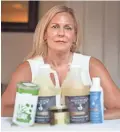  ??  ?? Diane Pineault, owner of Healthy Connection­s in Windsor, Ontario, uses a variety of massage oils and candles she imports from the U.S. for her business. The products face a 10 percent tariff because of trade tensions.