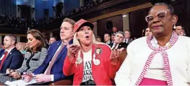  ?? SHAWN THEW/AP ?? Rep. Gwen Moore, D-Wis., right, sits next to Rep. Marjorie Taylor Greene, R-Ga., as President Joe Biden delivers the State of the Union address last week.