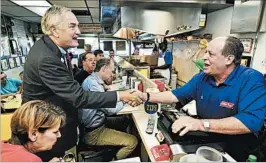  ?? ERIC SCHULTZ/AP ?? Sen. Luther Strange meets diner owner Wayne Salem after voting Tuesday in Birmingham.