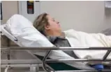  ?? LORI LECKIE VIA THE CANADIAN PRESS ?? Jamie-Lee Ball, 25, lies on a gurney in hospital on March 25. She spent five days in Brampton Civic Hospital’s hallways as the result of abdominal pain.