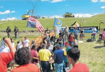  ?? James MacPherson ?? FROM A handful of Native Americans, the protest against the Dakota Access oil pipeline near the Standing Rock Sioux reservatio­n has grown to include internatio­nal environmen­tal groups and celebrity support.