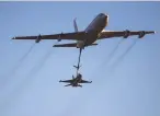  ?? (Nir Elias/Reuters) ?? AN IAF F-16 refuels with a Boeing 707.