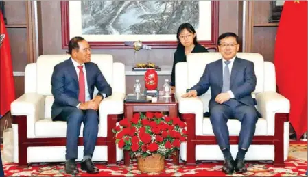  ?? CMAA ?? CMAA’s Ly Thuch (left) meets with Chinese ambassador Wang Wentian to discuss mine action cooperatio­n, on January 3.