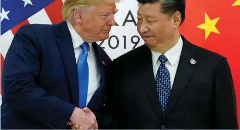  ??  ?? Best of enemies: Donald Trump and Xi Jinping in happier times.