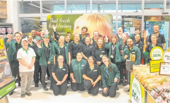  ?? ?? Staff in the Hawera Woolworths store enjoyed celebratin­g being the 50th store in the country to transform from Countdown to Woolworths branding.