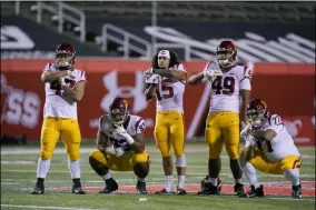  ?? THE ASSOCIATED PRESS ?? Southern California players pose for a photograph after their NCAA college football game against Utah Sunday, Nov. 22, 2020, in Salt Lake City.