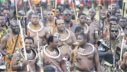  ?? Picture: Reuters ?? KING’S MEN. eSwatini’s King Mswati III, centre, arrives with his regiments at Ludzidzini royal palace during the Reed Dance last month.