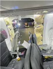  ?? /Reuters ?? Blowout: Oxygen masks hang from the roof beside a missing window and part of a side wall of an Alaska Airlines plane.