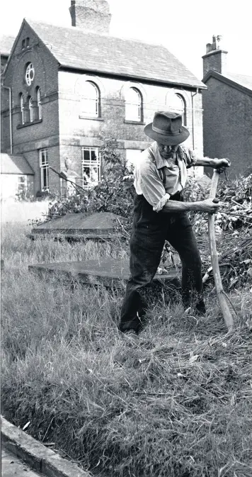  ??  ?? Geoff photograph­ed this man cutting the grass in the burial ground of Mount Pleasant Chapel more than 50 years ago.