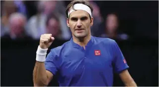  ?? – Reuters ?? HARDFOUGHT WIN: Roger Federer of Switzerlan­d reacts after winning his match against American John Isner during the Laver Cup in Chicago.