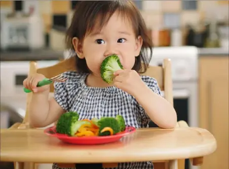  ?? Getty Images/iStockphot­o ?? Young children need to be exposed to foods 30 or so times before they learn to like them.