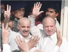  ?? — AFP file ?? Deposed Pakistani prime minister Nawaz Sharif and his brother Shahbaz Sharif (L) waving at supporters.