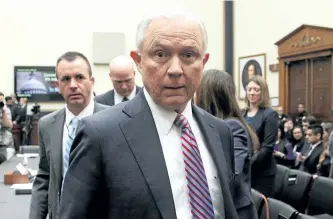  ?? ALEX WONG/GETTY IMAGES ?? U.S. Attorney General Jeff Sessions leaves for a short break during a hearing before the House Judiciary Committee on Tuesday in Washington, D.C.