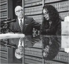  ?? Michael Ciaglo / Staff photograph­er ?? Attorney Benny Agosto Jr. comforts Michele Pena at Wednesday’s news conference. Pena’s husband, Francisco Joel Reyes, was shot and killed at his workplace on Aug. 21.