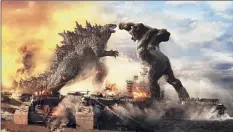  ?? Warner Bros. Pictures / Washington Post News Service ?? Godzilla battles Kong in "Godzilla vs. Kong." The movie is in theaters and streaming simultaneo­usly on HBO Max.