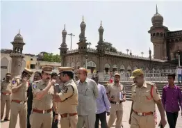  ?? — PTI ?? South zone DCP V. Satyanaray­ana and other officials at the historic Mecca Masjid in old city of Hyderabad on Monday. A Special NIA court on Monday acquitted all accused in 2007 Mecca Masjid blast case.