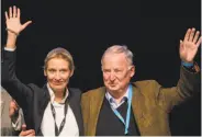  ?? Rolf Vennenbern­d / Associated Press ?? Alice Weidel and Alexander Gauland greet Alternativ­e for Germany delegates in Cologne.