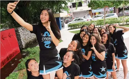  ??  ?? Cyrens captain yang taking a selfie – cheerleade­r style – with her teammates, a week after their CHEEr 2016 win. — yAp CHEE HONG/ The star