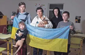  ?? EVGENIY MALOLETKA/AP ?? Mother of nine Natalia Zhyvohliad left her home in occupied Ukraine after facing pressure for her and her children to take Russian citizenshi­p.