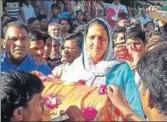  ??  ?? Krishna Poonia coming out of a counting station at Sadulpur in Churu district of Rajasthan after her victory. HT PHOTO