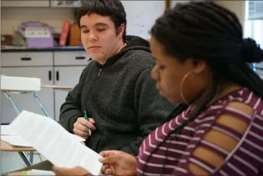  ?? ALLEN G. BREED ?? Joseph Tucker watches as Makizah Cotton makes an argument in civics class at Chatham Central High School in Bear Creek, N.C., on Tuesday, Nov. 5, 2019. The 10th-graders were debating whether President Trump should be impeached.