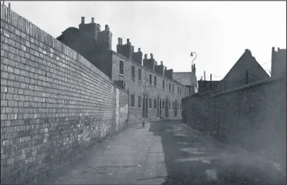  ??  ?? Looking down Dead Lane from Bridge Street. Harry Russell lived at No.2 Dead Lane with his mother and sisters at the home of his grand parents