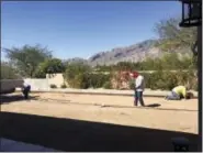  ?? JOHN VYBORNY VIA AP ?? This March 2017 photo provide by John Vyborny shows workers building a Bocce ball court at Vyborny’s home in Tuscon, Ariz.