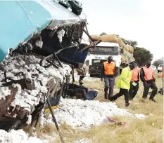  ??  ?? Vehicle Inspection Department officers inspect an accident scene where 35 passengers lost their lives after two buses rammed onto a stationery truck which did not have reflectors at night in 2013. - Pictures by John Manzongo