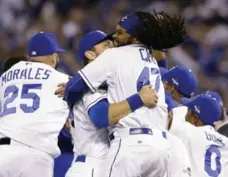  ?? ORLIN WAGNER/THE ASSOCIATED PRESS ?? Kansas City Royals’ Ben Zobrist, left, celebrates with starting pitcher Johnny Cueto after eliminatin­g the Houston Astros in Game 5.